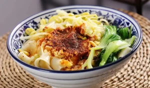 Finished Sichuan cold noodles serving context for reviewing texture, temperature, and garnish