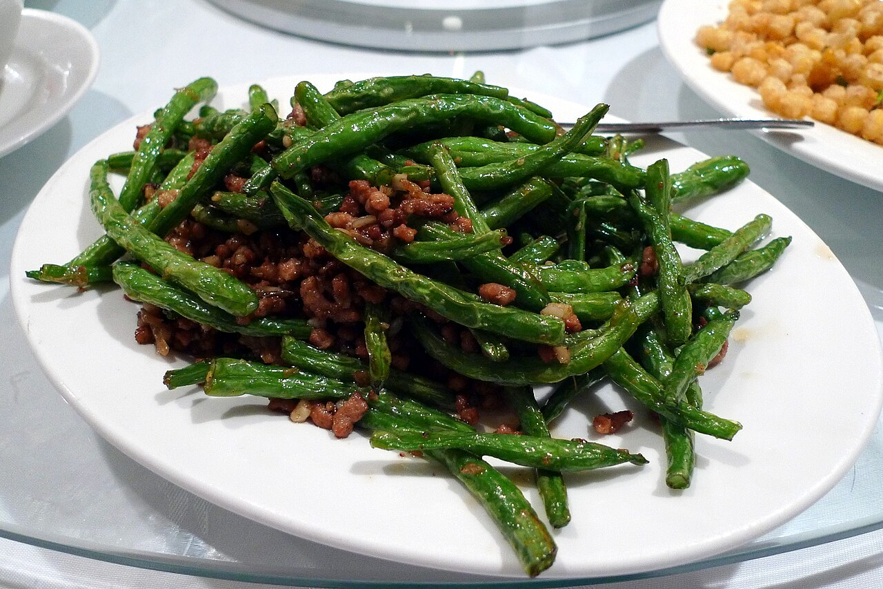 Sichuan Dry Fried Green Beans Recipe: Texture, Heat, and Stir-Fry Steps 1 sichuan dry fried green beans recipe opening image showing Sichuan green beans in a clear landscape context