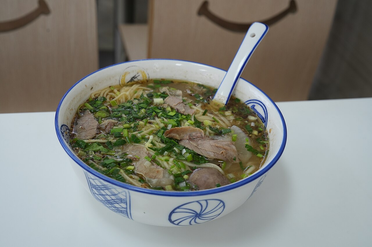 sichuan beef noodle soup recipe opening scene showing beef noodle soup