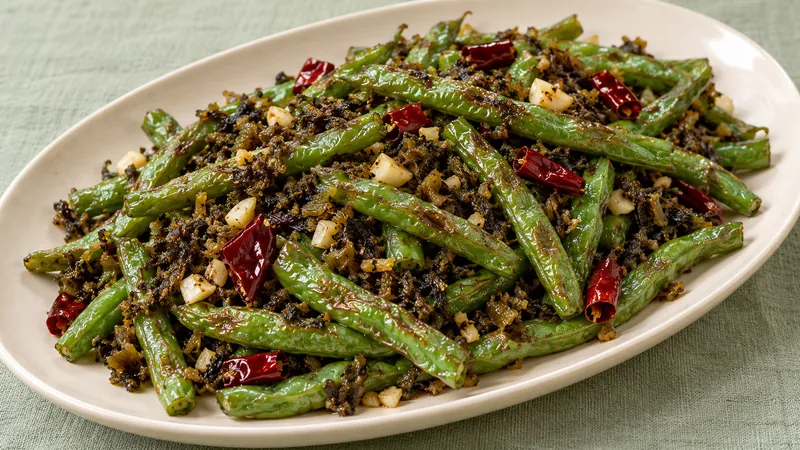 Sichuan Green Beans Recipe: Texture, Heat, and Timing Checks 1 Wrinkled green beans with chopped preserved mustard vegetable, garlic and dried chili