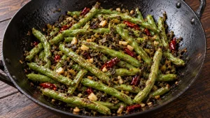 Sichuan Green Beans Recipe: Texture, Heat, and Timing Checks 29 Seared green beans with garlic, dried chili and preserved mustard vegetable in a wok