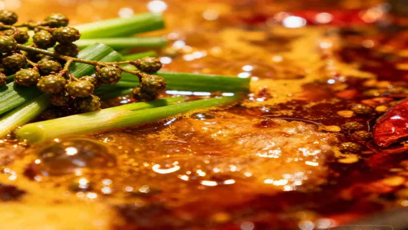 10 Mistakes That Ruin Sichuan Hot Pot Recipe (And How to Fix 3 Close view of red hot-pot broth and green vegetables