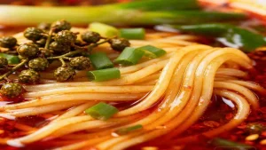 Noodles and scallions in red broth