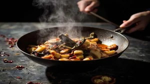 Fish-Fragrant Eggplant: Sichuan Recipe and Home Cooking Tips 14 Eggplant pieces cooking in a wok