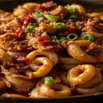 Spicy Stir-Fried Squid: Sichuan Recipe and Home Cooking Tips 4 Squid rings in red chili sauce with scallions