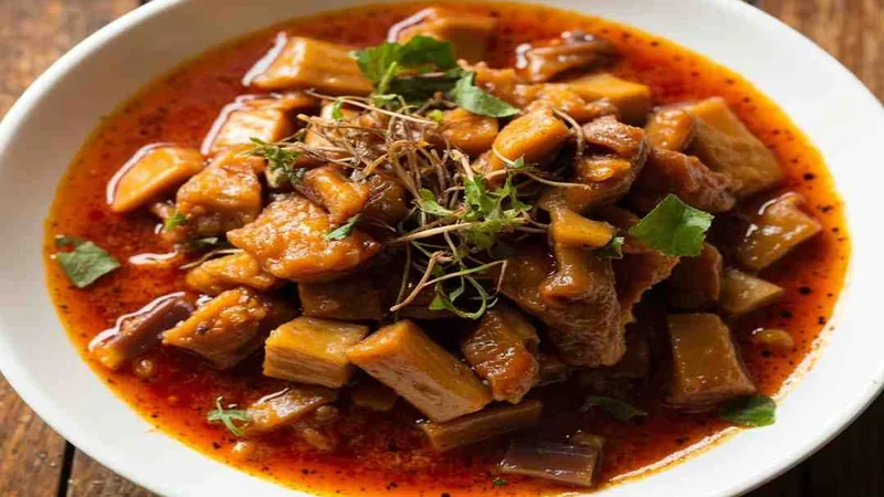 Sichuan Food Recipes: Classic Dishes and Home Cooking Tips 1 Mixed dish with tofu pieces and chopped green garnish