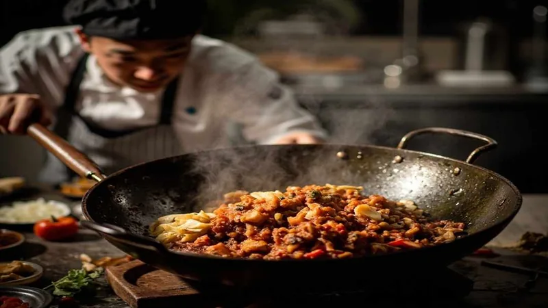 Sichuan Food Recipes: Classic Dishes and Home Cooking Tips 2 Cook tending a wok with red chilies nearby