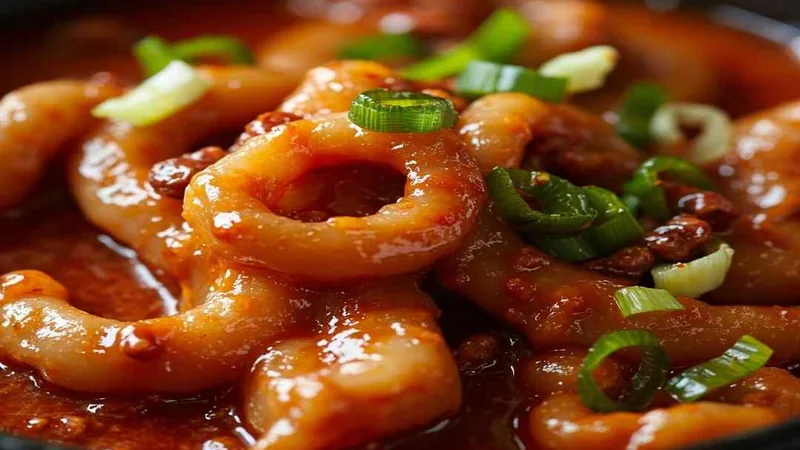 Sichuan Food Recipes: Classic Dishes and Home Cooking Tips 3 Close view of ring-shaped ingredients in glossy sauce
